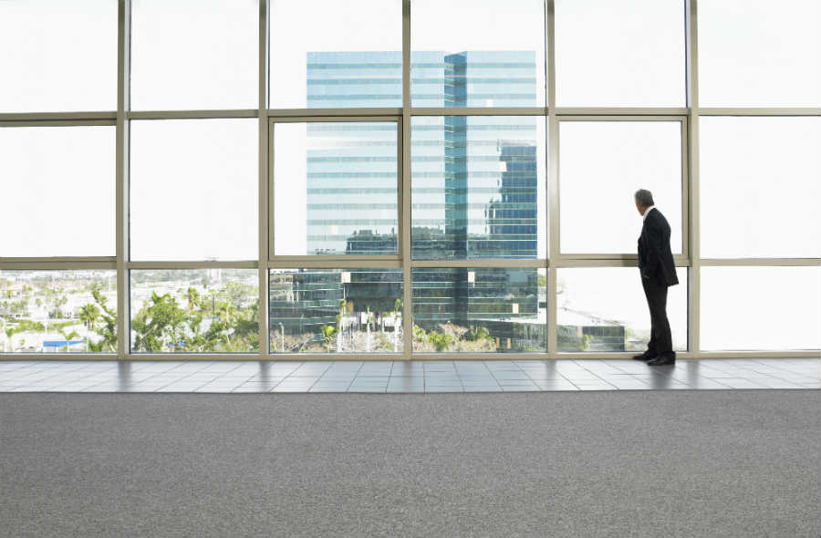 A new building stands outside a window