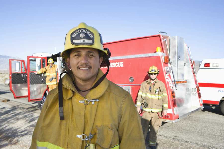 A firefighter wearing full protective fire safety gear