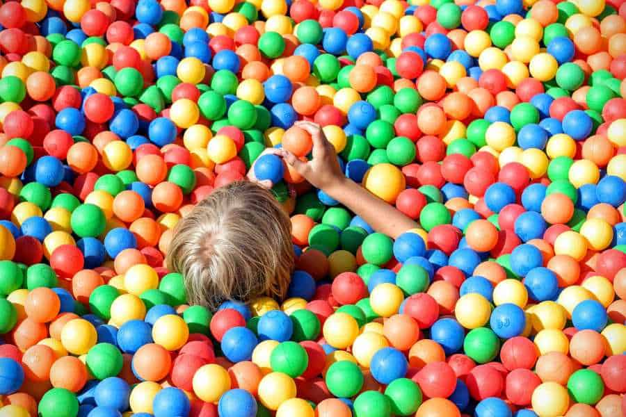 Children playing in a ball pit