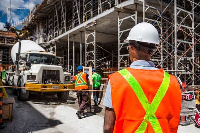 Construction worker in safety gear on construction site