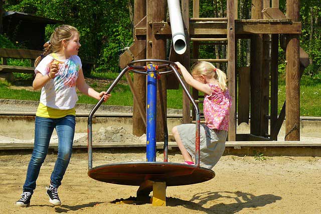 Children learning balance on a playground