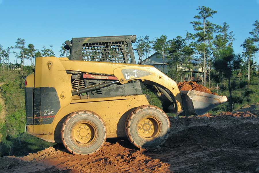 Skid Steer Loader Hauling Dirt