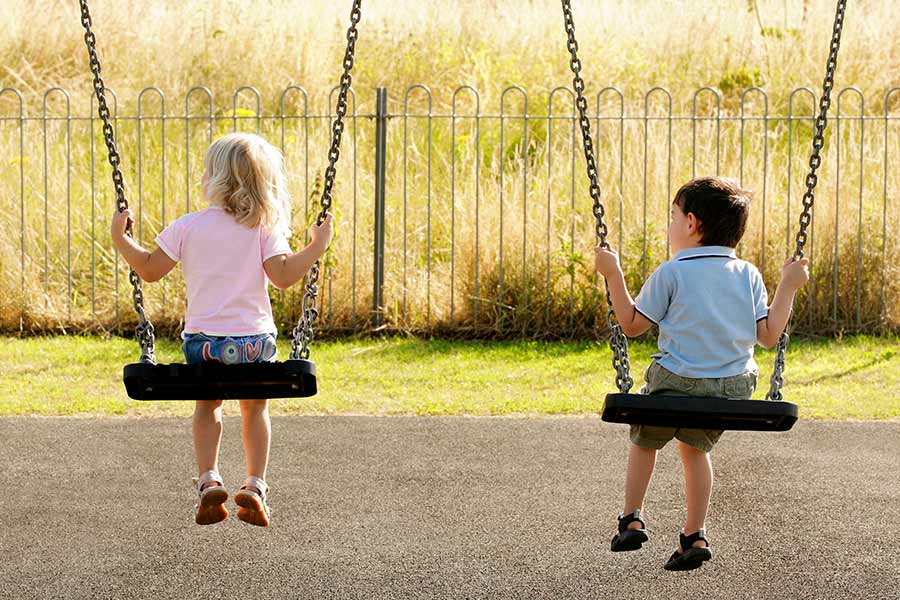 Children at a playground built by Austin contractors