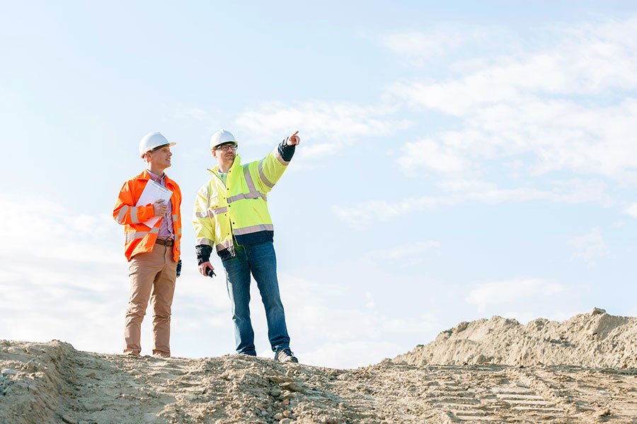 A construction manager relays plans to his construction company in Austin TX.