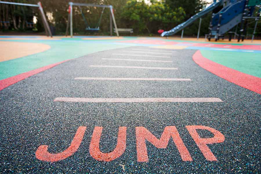 Playground with rubber surface installed by Austin contractors