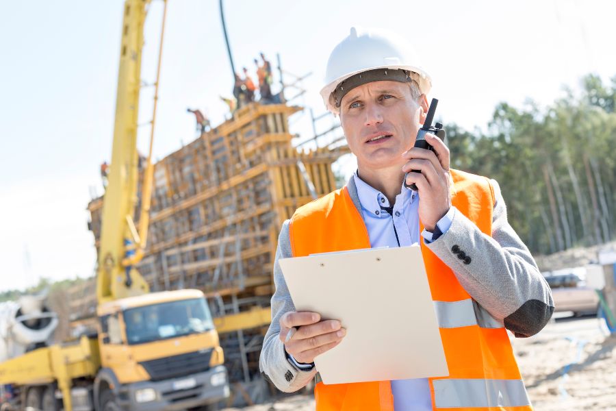 Construction worker talking on radio