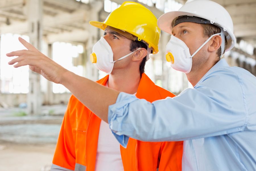 Workers in masks on construction site