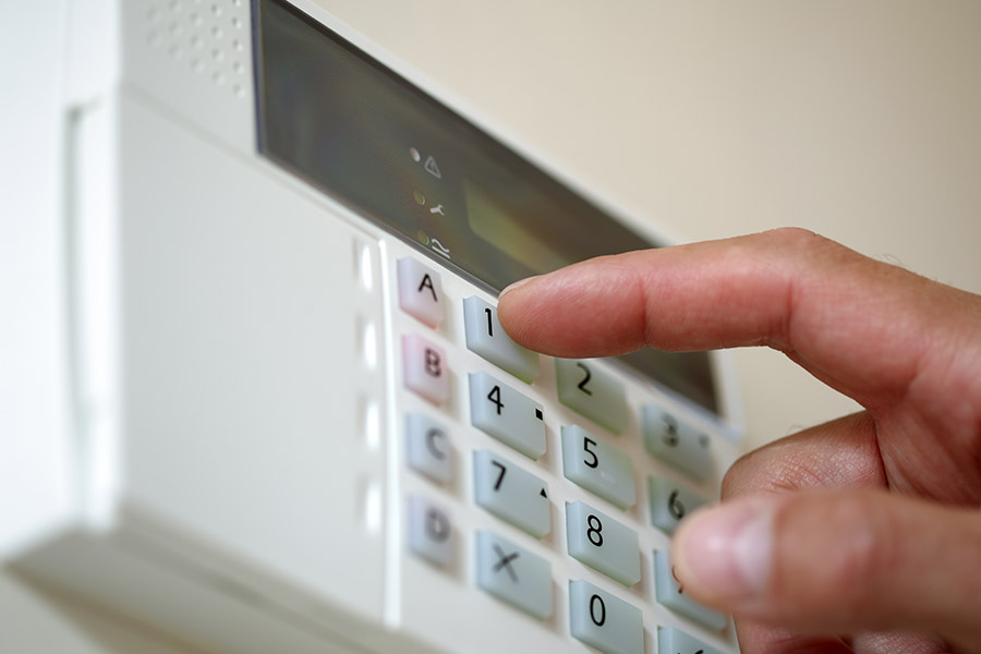 Man inputting Security System code