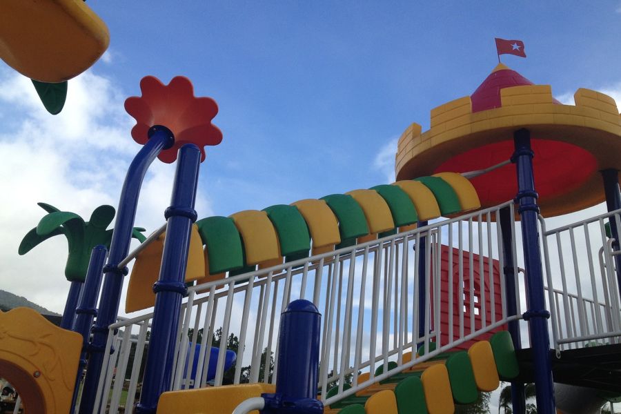 Photo of colorful stairs going up to playground slide