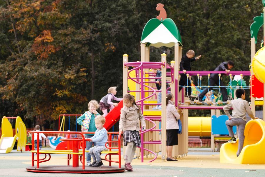 kids playing on a colorful fun playground