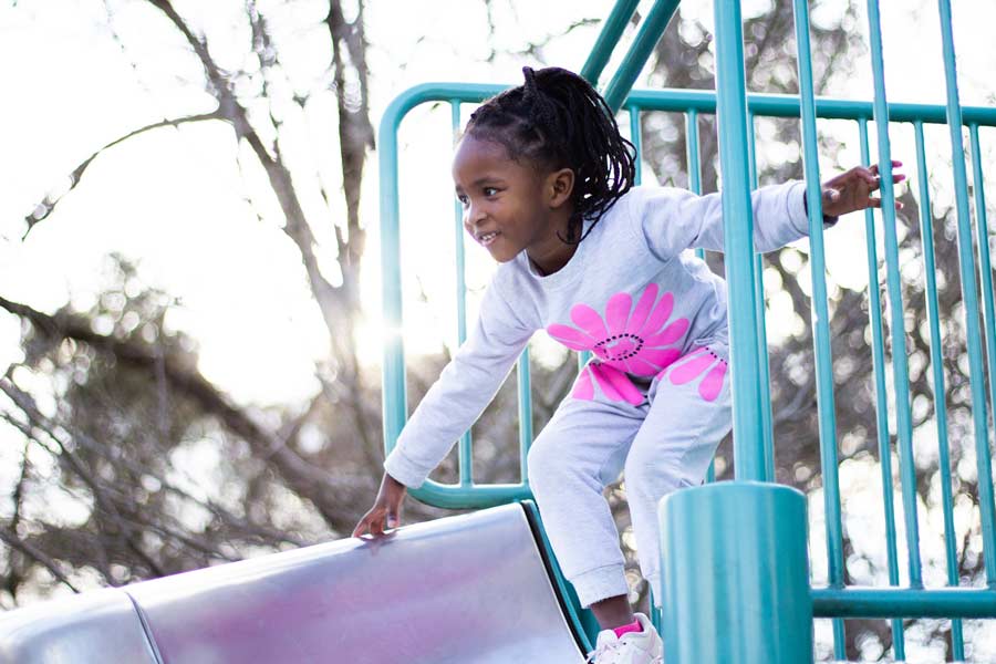 Girl engaging in play on a plalyground