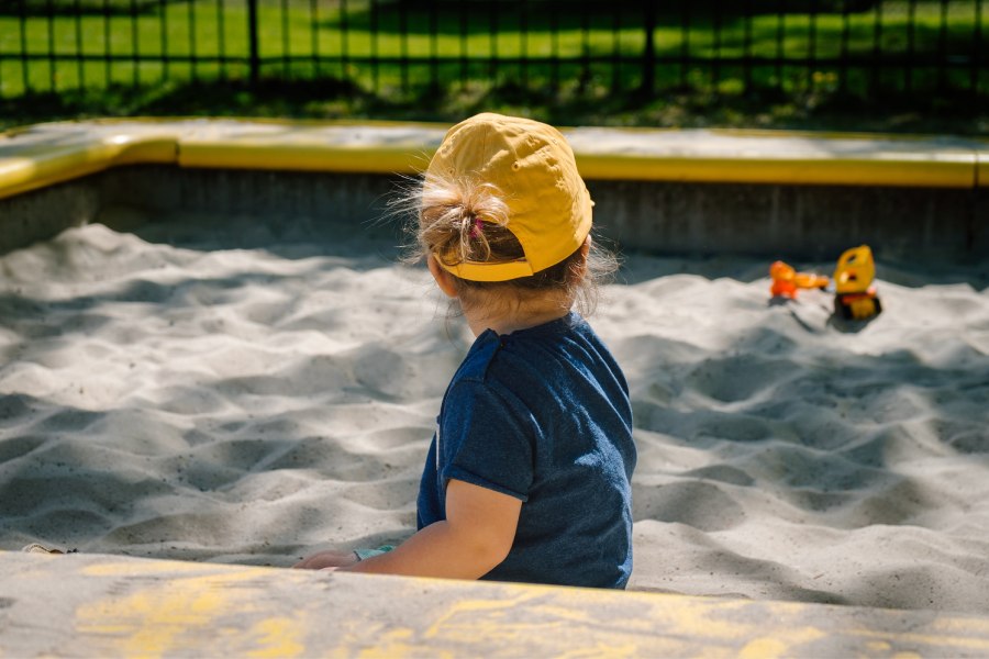 little girl playing in the sand