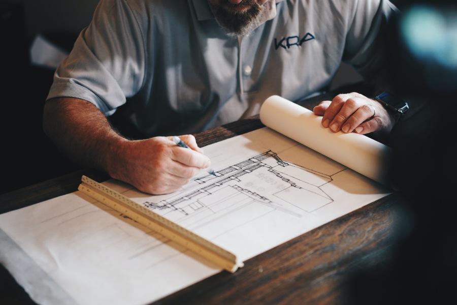 Construction Project Manager reviewing documents for a proposal