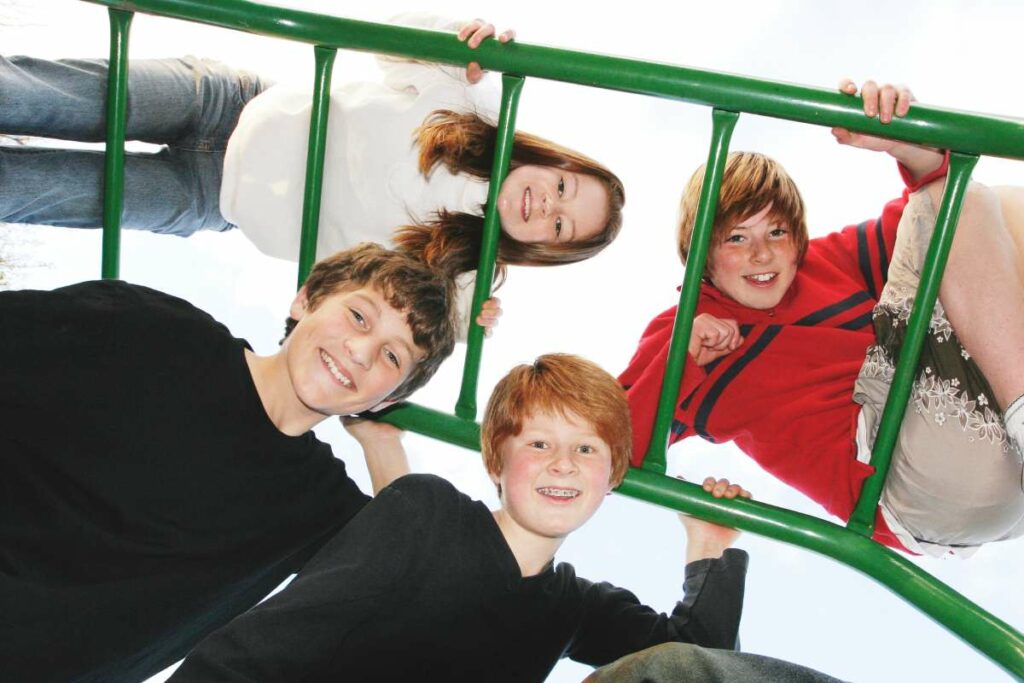 Kids playing on monkey bars