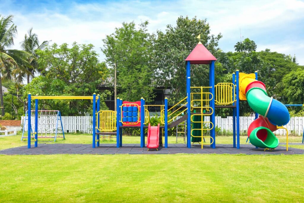 Playground with artificial turf and safety flooring