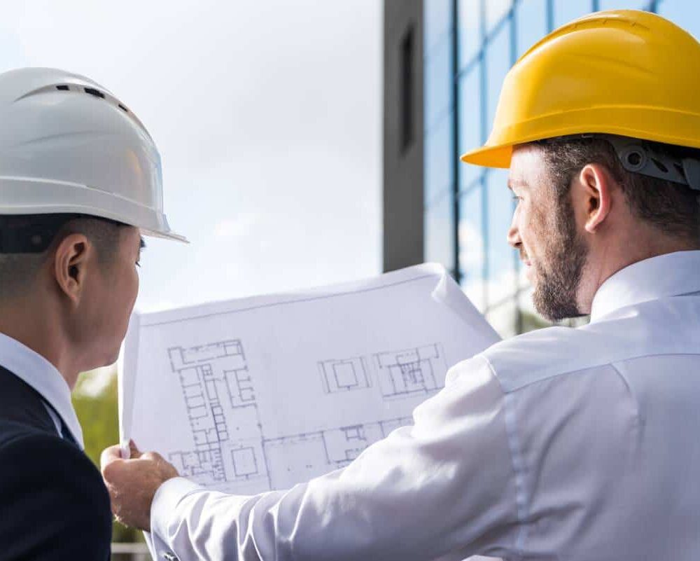 workers looking at the Design of a new building