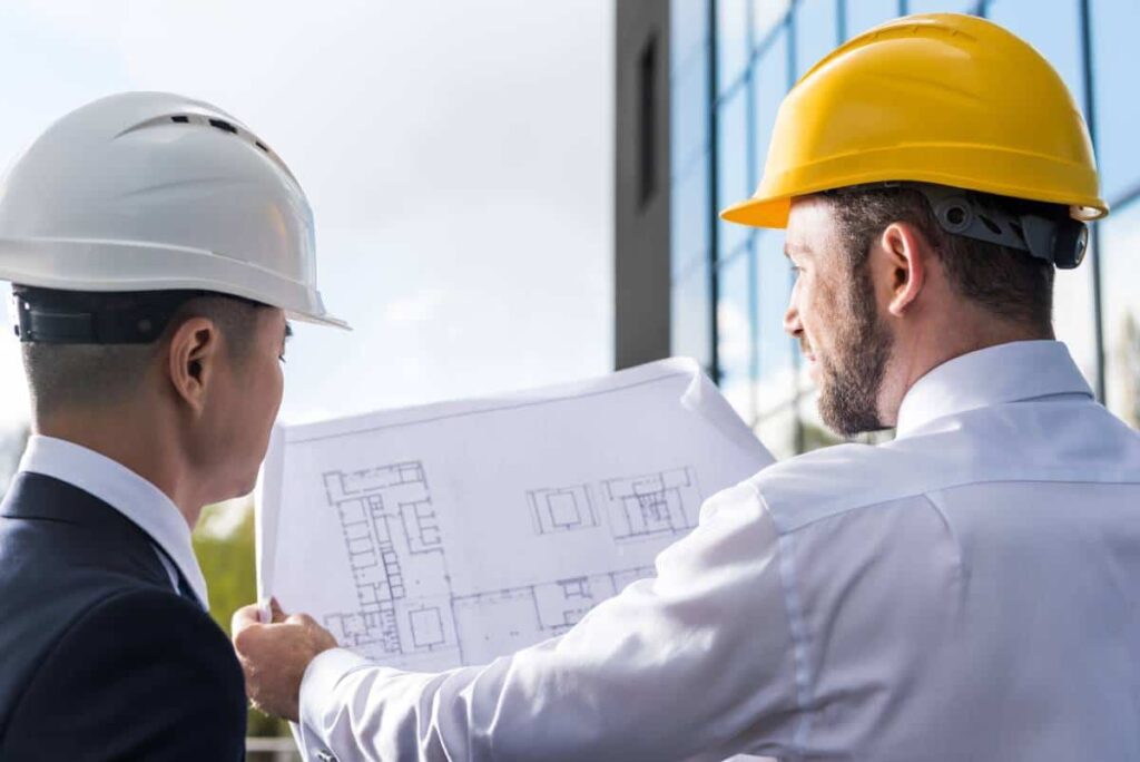 workers looking at the Design of a new building