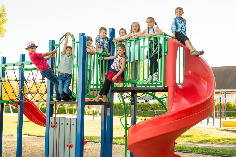 An image of children happily playing in a playground