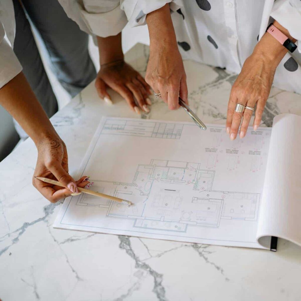 Business Owner and Construction Contractor Discussing Office Remodeling Plans